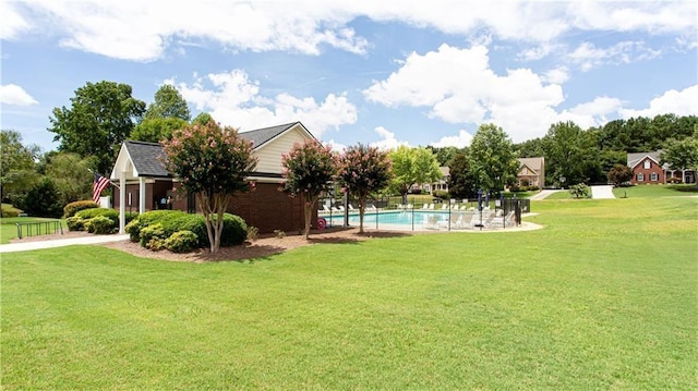 view of yard with a fenced in pool