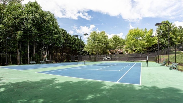 view of sport court with fence