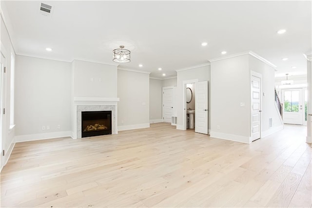 unfurnished living room featuring visible vents, baseboards, light wood-style flooring, recessed lighting, and a fireplace