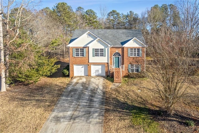 raised ranch featuring a garage