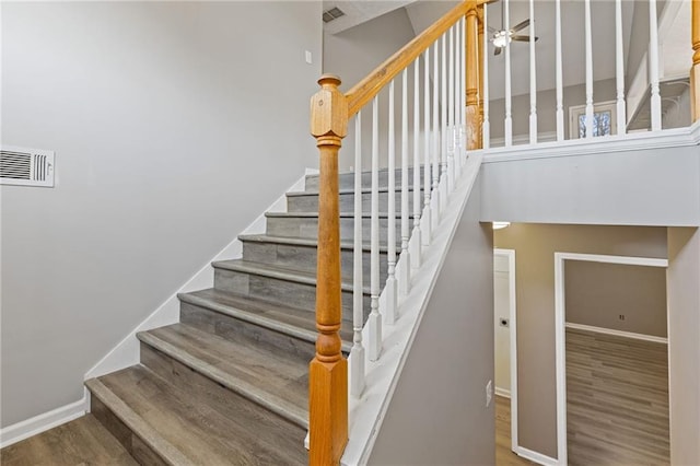 stairs with wood-type flooring