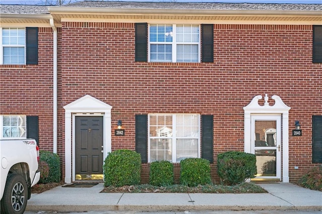 view of property with brick siding