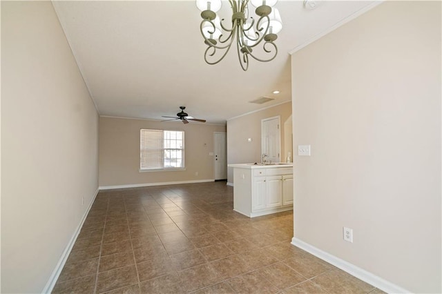 tiled empty room featuring ornamental molding, a sink, baseboards, and ceiling fan with notable chandelier