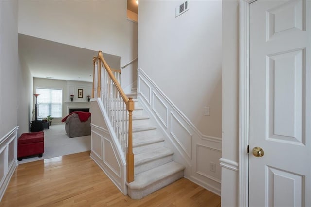 staircase featuring hardwood / wood-style flooring