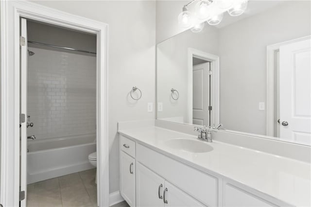 full bathroom featuring oversized vanity, toilet, shower / washtub combination, and tile flooring