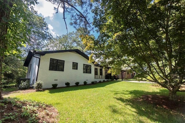 view of home's exterior featuring a yard