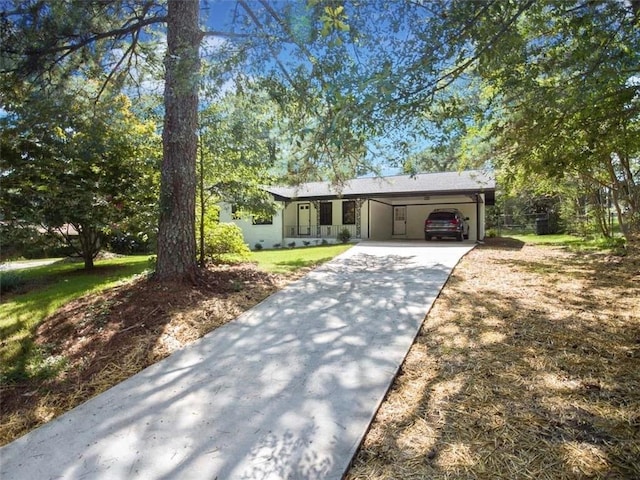 ranch-style home featuring a front yard and a garage