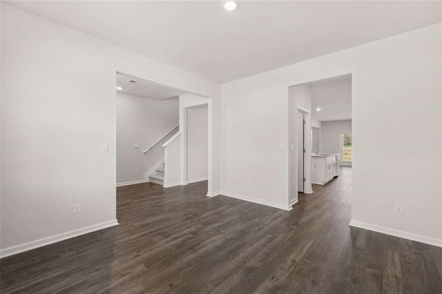 5430 Flat Rock Pt, Stonecrest, GA 30038 - spare room with stairs, dark wood-style flooring, baseboards, and recessed lighting