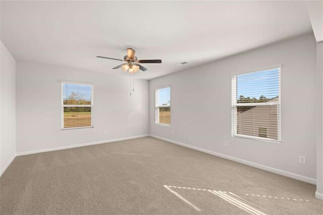 5430 Flat Rock Pt, Stonecrest, GA 30038 - spare room featuring a ceiling fan, carpet flooring, and baseboards