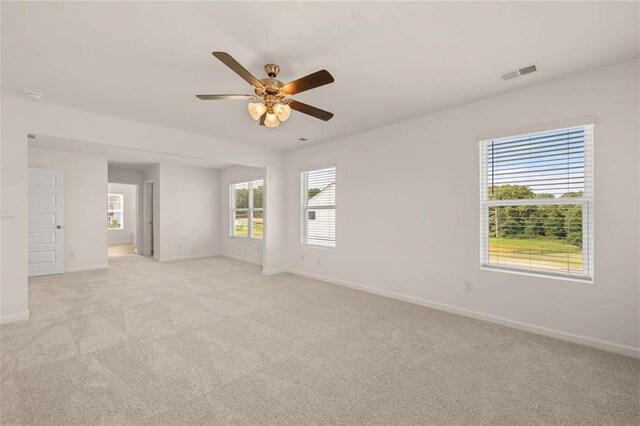 5430 Flat Rock Pt, Stonecrest, GA 30038 - spare room featuring baseboards, light carpet, and a ceiling fan