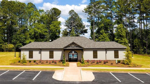 5430 Flat Rock Pt, Stonecrest, GA 30038 - view of building exterior featuring uncovered parking and view of wooded area