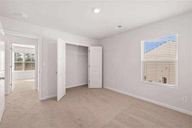 5430 Flat Rock Pt, Stonecrest, GA 30038 - unfurnished bedroom featuring baseboards, light carpet, and a closet
