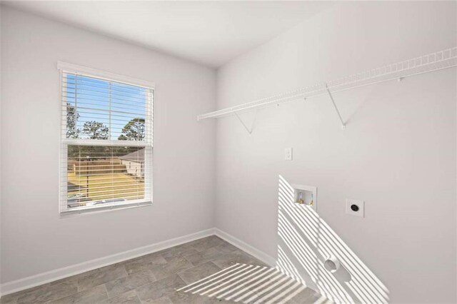 5430 Flat Rock Pt, Stonecrest, GA 30038 - laundry room with hookup for a washing machine, baseboards, hookup for an electric dryer, and stone finish floors