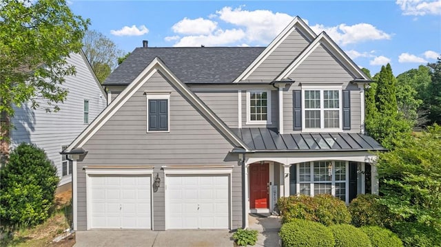 3525 Elder Field Ln, Cumming, GA 30040 - traditional home with concrete driveway, an attached garage, a standing seam roof, roof with shingles, and metal roof