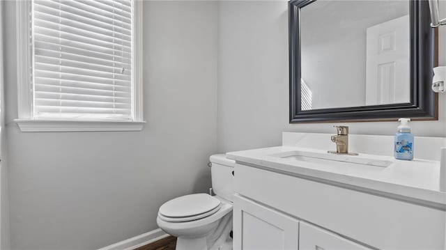 3525 Elder Field Ln, Cumming, GA 30040 - bathroom with toilet, vanity, baseboards, and wood finished floors