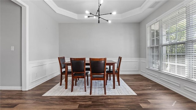 3525 Elder Field Ln, Cumming, GA 30040 - dining room with a chandelier, a raised ceiling, ornamental molding, wainscoting, and dark wood finished floors