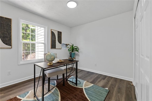 home office featuring dark hardwood / wood-style flooring