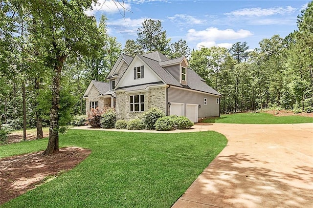 view of front of home featuring a front yard, driveway, and brick siding