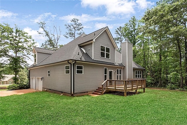 back of house featuring crawl space, a deck, a yard, a shingled roof, and driveway