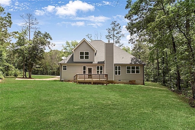back of house with crawl space, a wooden deck, a yard, a chimney, and roof with shingles