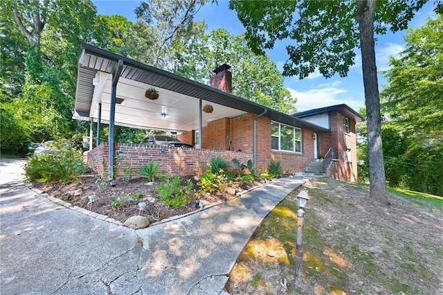 view of front of house featuring a carport