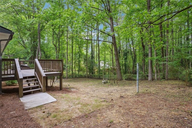 view of yard featuring stairs and a wooden deck