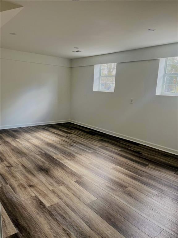 spare room with hardwood / wood-style floors