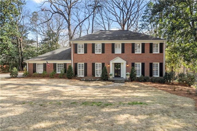 view of front of house featuring brick siding