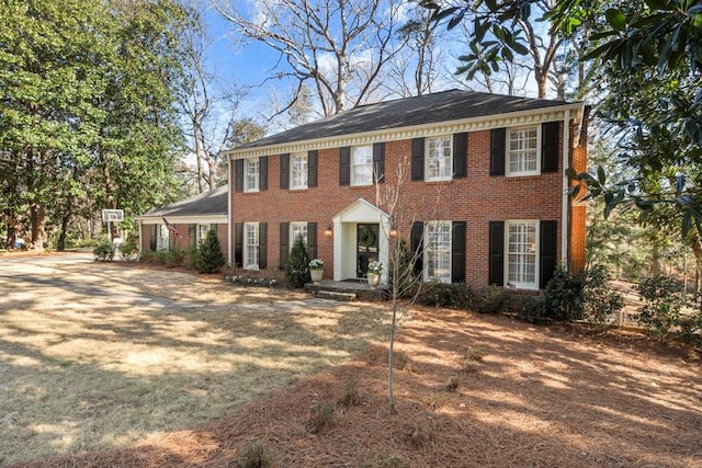 view of front of house featuring brick siding