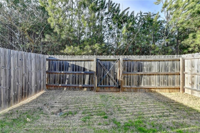 view of yard featuring a fenced backyard