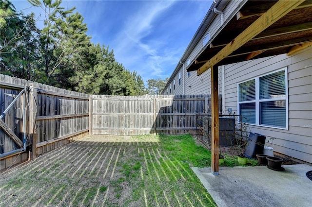 view of yard with a patio area and a fenced backyard