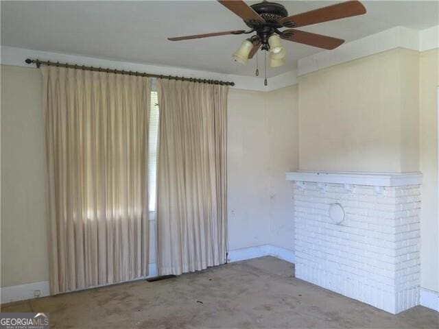 unfurnished living room with ceiling fan