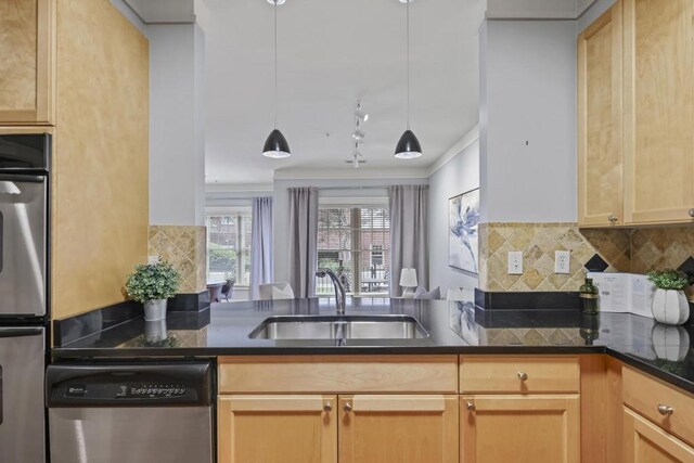 273 12th St NE Unit 421, Atlanta, GA 30309 - kitchen featuring a sink, stainless steel appliances, ornamental molding, track lighting, and decorative backsplash