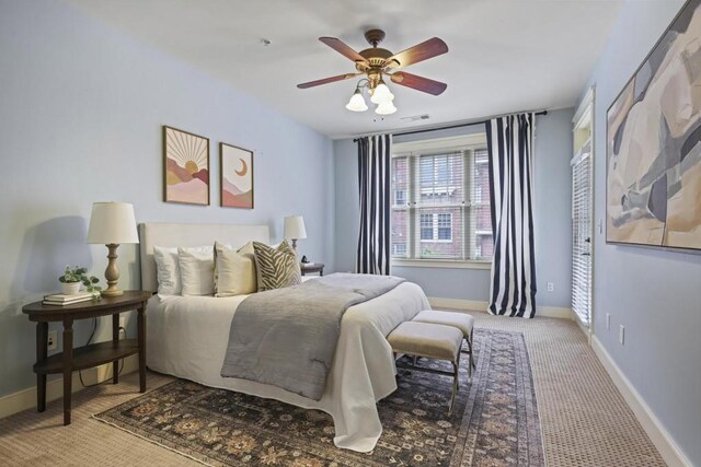273 12th St NE Unit 421, Atlanta, GA 30309 - carpeted bedroom featuring visible vents, baseboards, and ceiling fan