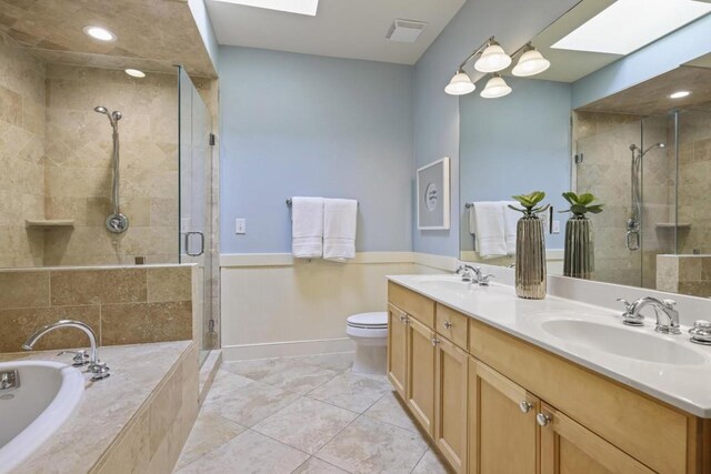 273 12th St NE Unit 421, Atlanta, GA 30309 - full bath with a sink, a stall shower, a bath, and visible vents