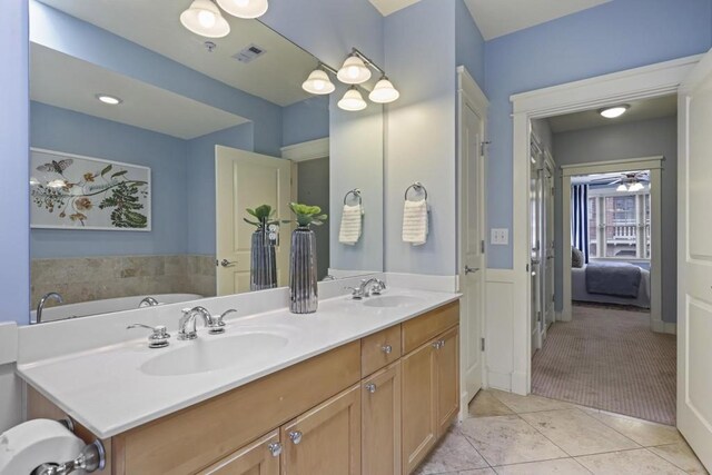 273 12th St NE Unit 421, Atlanta, GA 30309 - ensuite bathroom featuring a sink, tile patterned flooring, double vanity, and visible vents