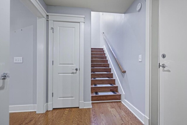 273 12th St NE Unit 421, Atlanta, GA 30309 - stairs with baseboards and wood finished floors