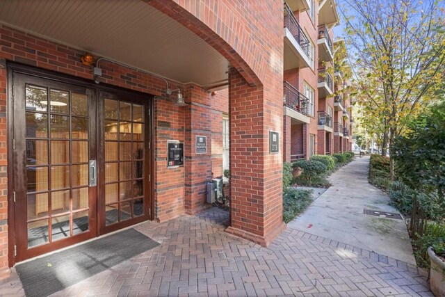 273 12th St NE Unit 421, Atlanta, GA 30309 - property entrance featuring brick siding and french doors