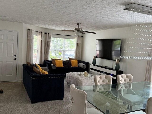 1218 Matt Moore Ct, Lithia Springs, GA 30122 - carpeted living area featuring a textured ceiling and ceiling fan