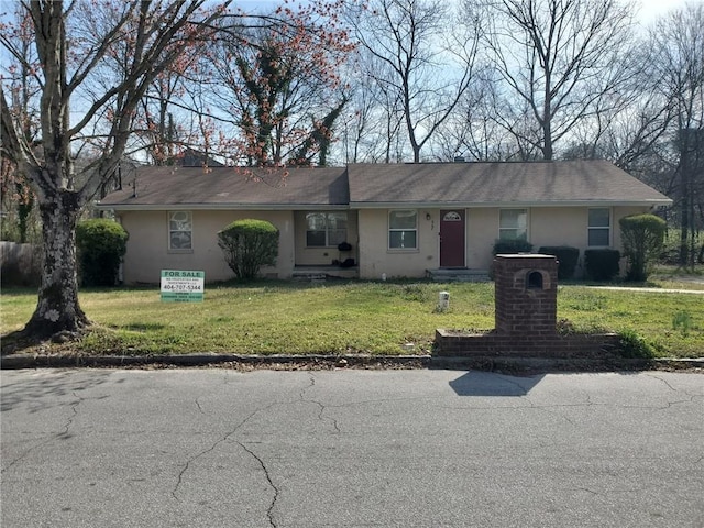 867 Commodore Dr NW, Atlanta, GA 30318 - ranch-style house featuring stucco siding and a front yard