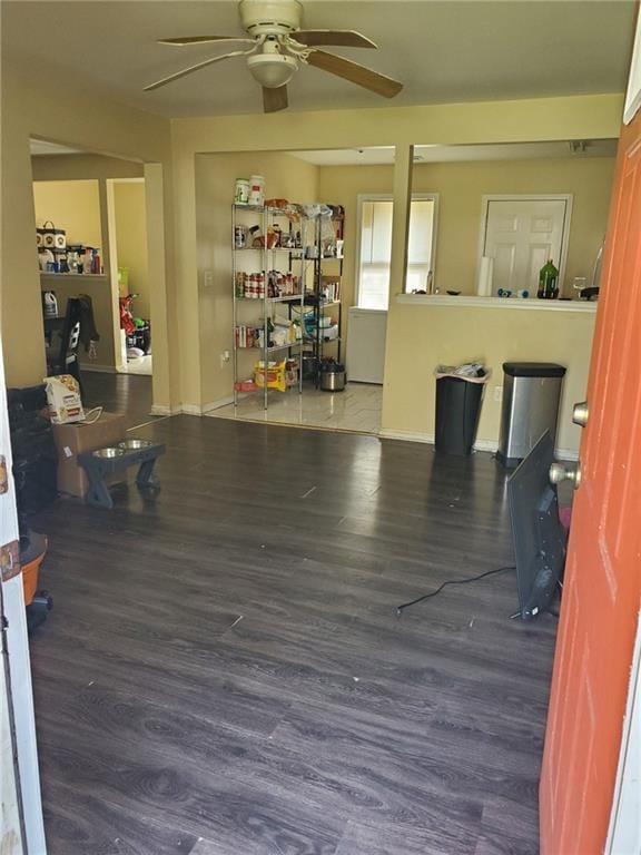 867 Commodore Dr NW, Atlanta, GA 30318 - interior space featuring a ceiling fan, baseboards, and wood finished floors