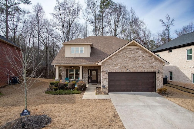 craftsman-style home featuring a garage and covered porch