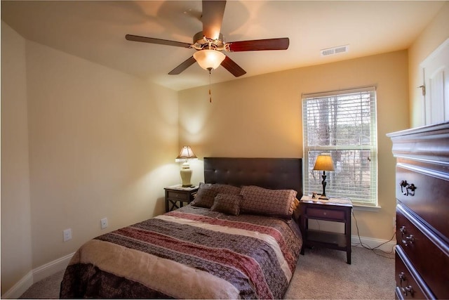 carpeted bedroom with ceiling fan