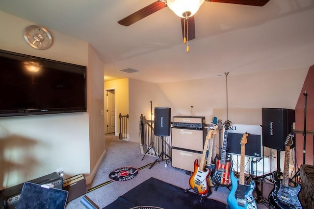 workout room with light carpet and ceiling fan