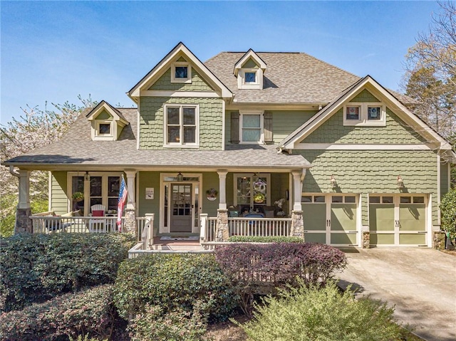3828 Morning Meadow Ln, Buford, GA 30519 - craftsman house featuring covered porch, roof with shingles, concrete driveway, and a garage