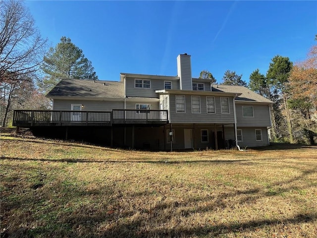 back of house with a yard and a wooden deck