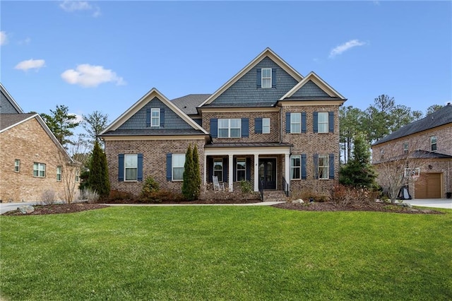 view of front of property featuring brick siding and a front lawn