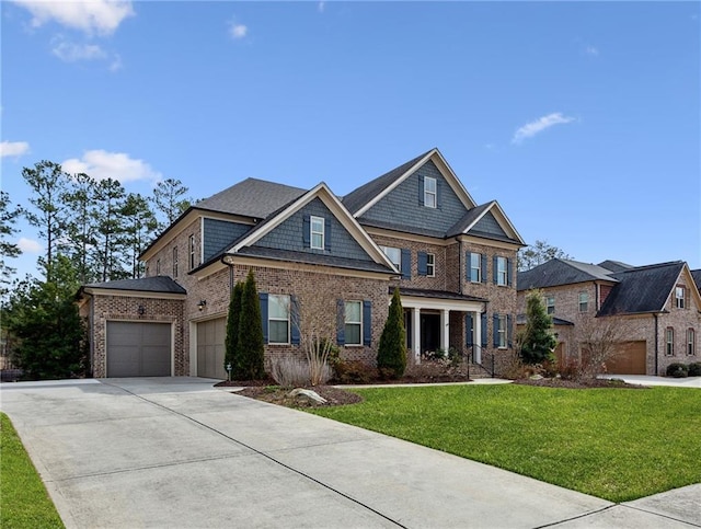 view of front facade with brick siding, driveway, an attached garage, and a front lawn