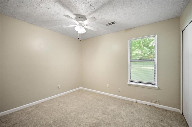 5426 Martins Crossing Rd, Stone Mountain, GA 30088 - unfurnished room featuring carpet flooring, ceiling fan, and a textured ceiling