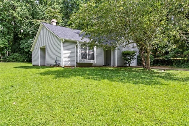 5426 Martins Crossing Rd, Stone Mountain, GA 30088 - view of front of property with a chimney, a front yard, and a shingled roof